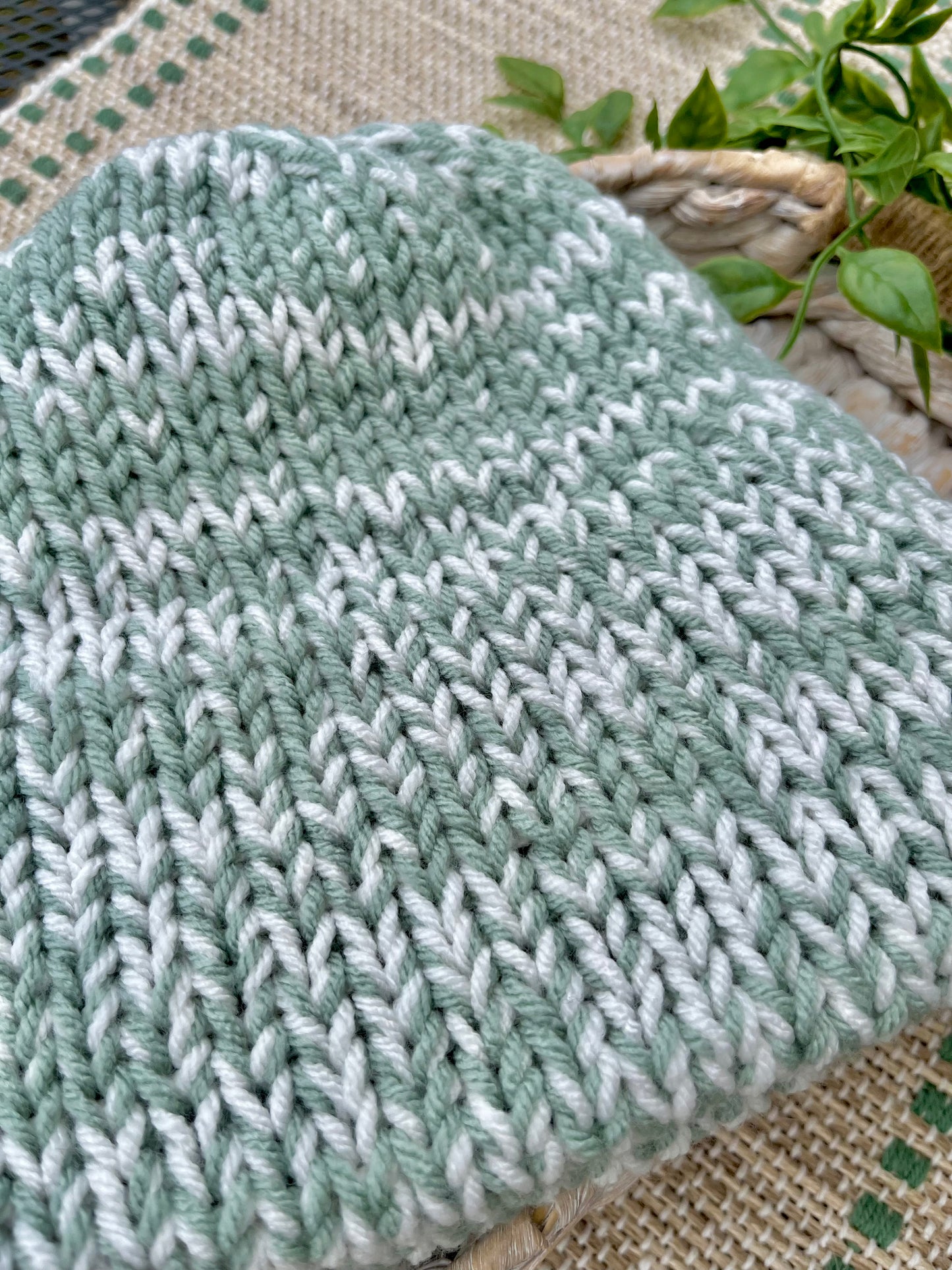 green and white knit beanie